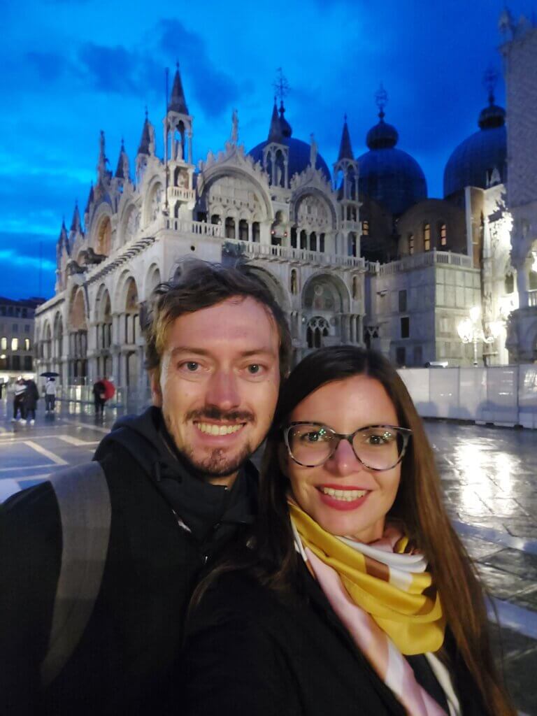A night time rainy selfie of Mirka and Daniel taken in front of the St Mark's Basilica in Venice.