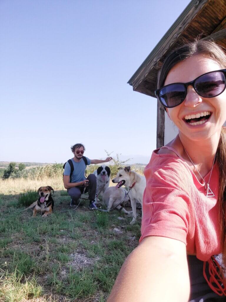 Mirka and Daniel taking a selfie with 4 dogs
