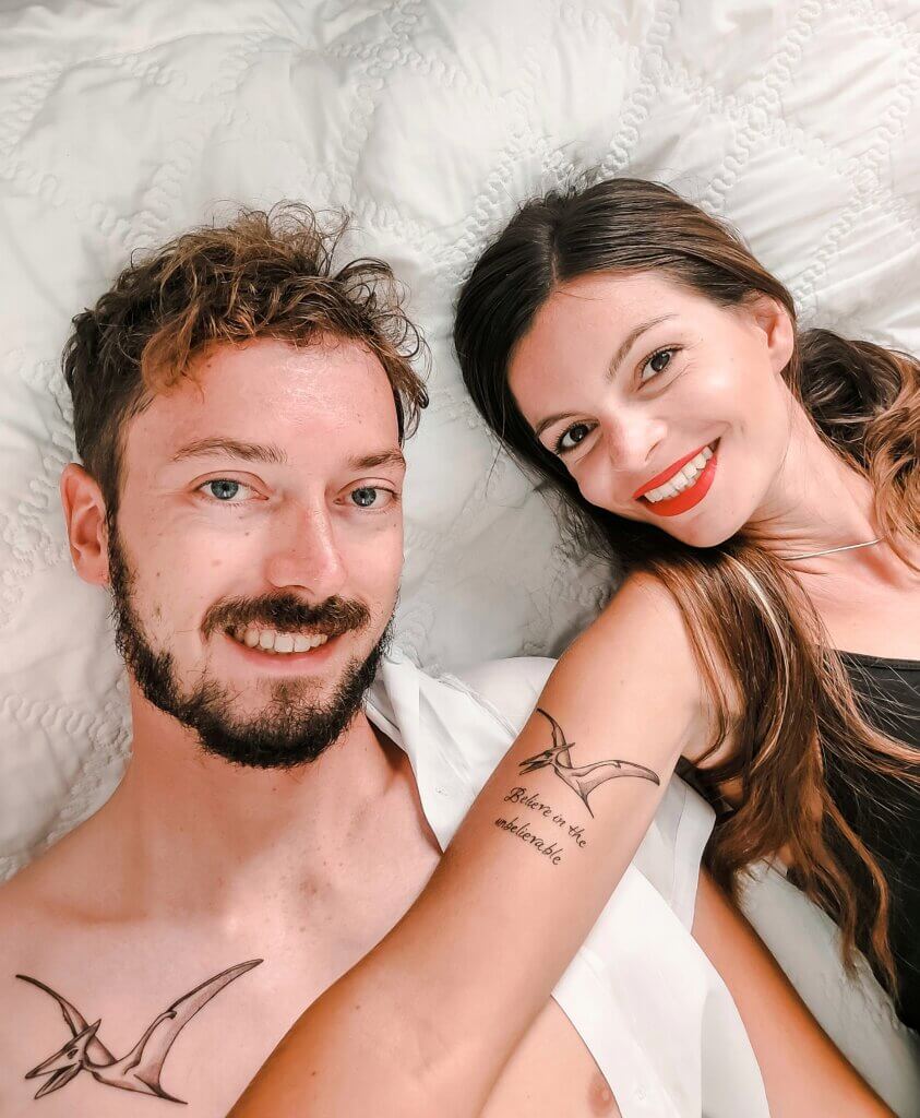 Mirka and Daniel showing their new pterodactyl matching tattoos