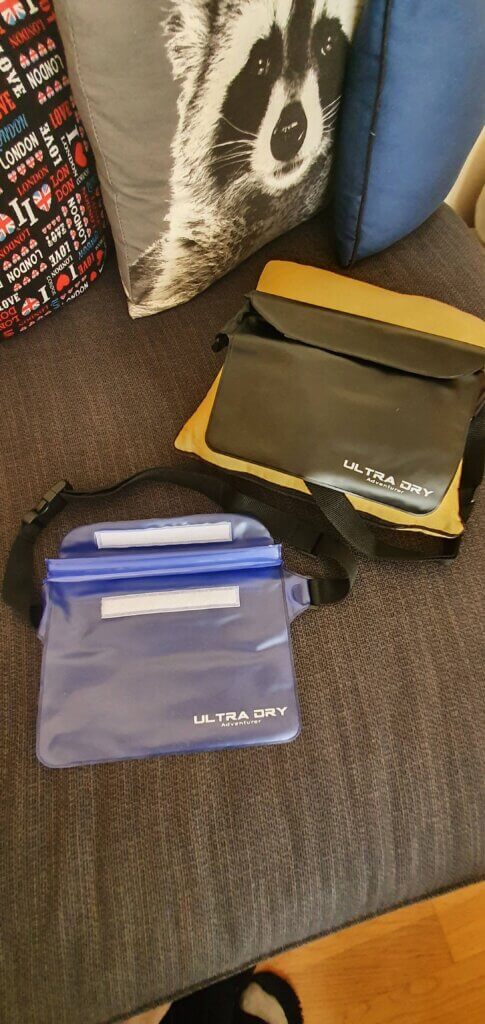 A black and a clear-blue waterproof bumbags