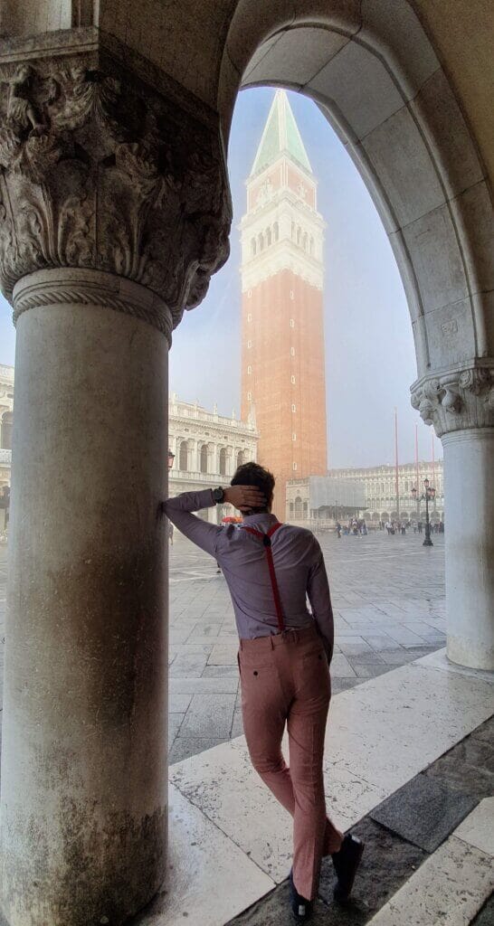 Daniel posing with St Mark's Campanile in the mist in the background