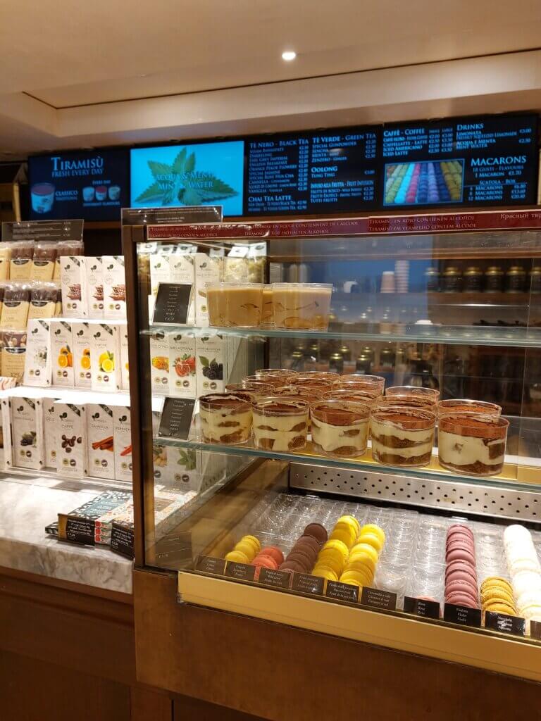 Inside of the gourmet shop with tiramisu tubs and other products
