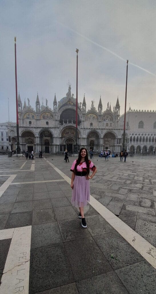 Mirka posing on St Mark's Square in front of the Basilica