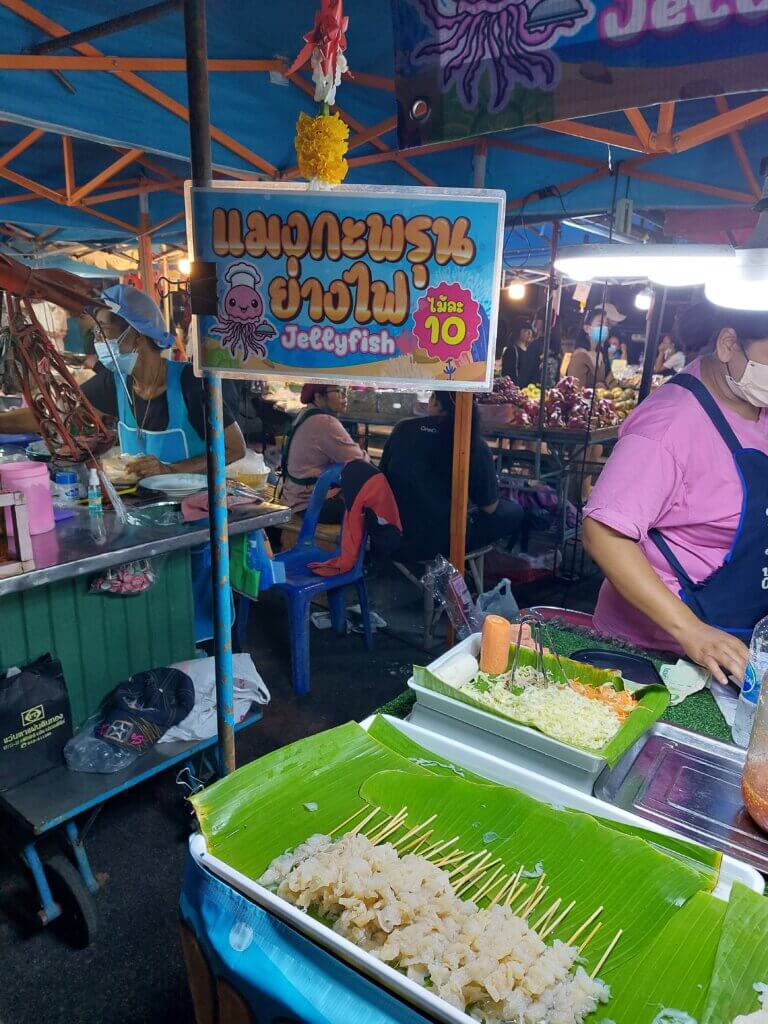 Market stall selling jellyfish on a stick