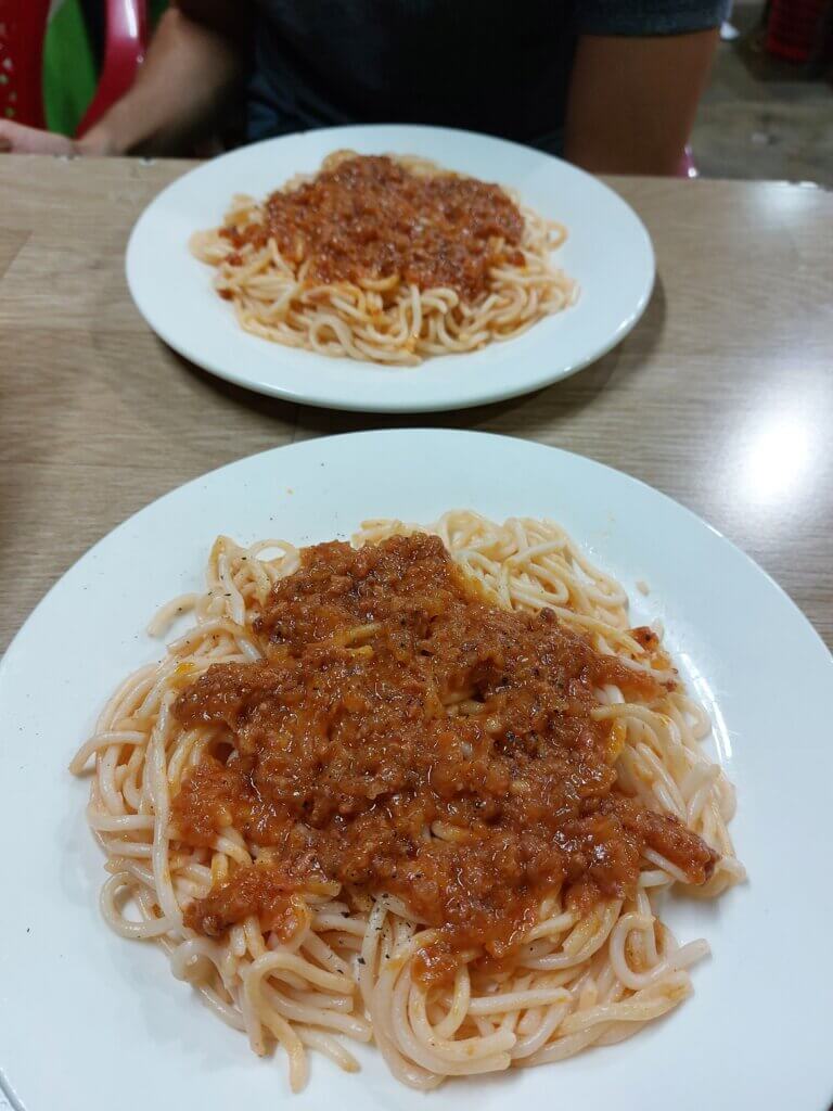 How to Use AI for Travel Planning: An Effortless Guide 5 Two plates of spaghetti bolognese