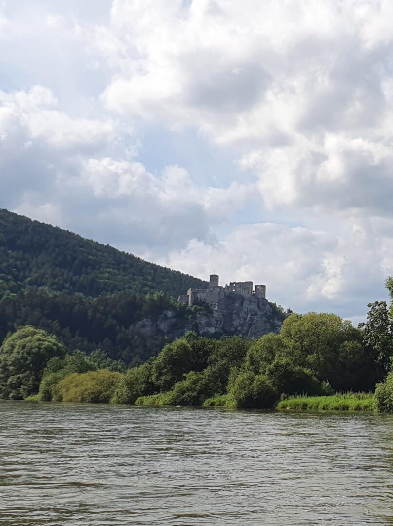 Old castle ruins on a hill shot from a river
