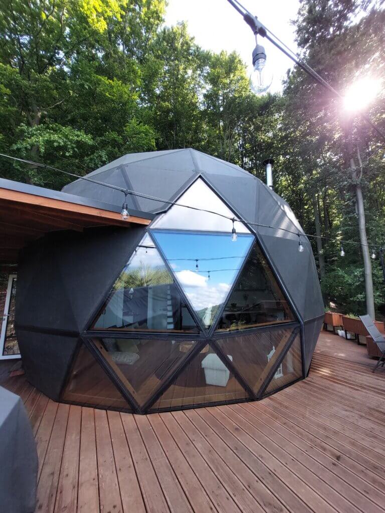A dome structure on a wooden terrace, to show what budget glamping in Slovakia looks like