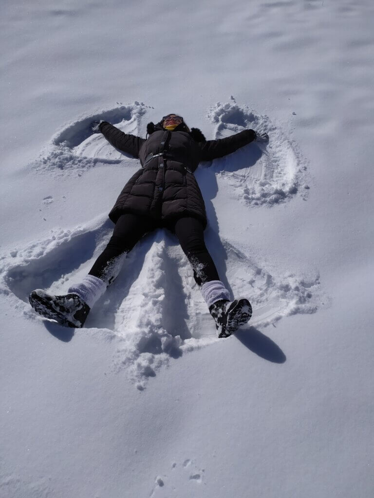 Mirka making a snow angel 