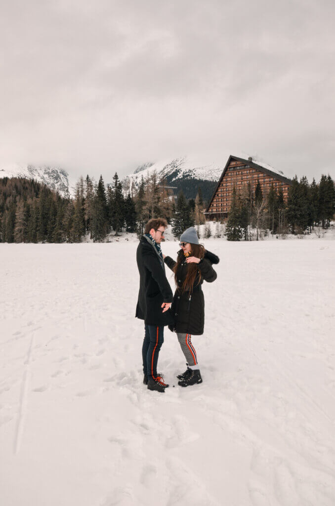 Mirka and Daniel standing in the middle of a snow-covered lake