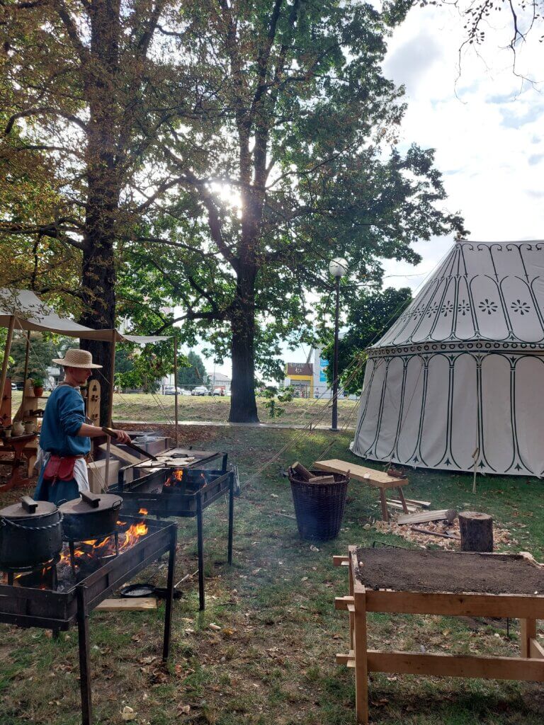 Medieval tent and a person doing crafts