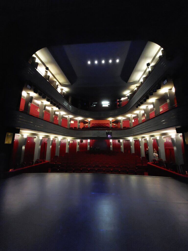 A shot of an empty theatre taken from the stage towards the seating area