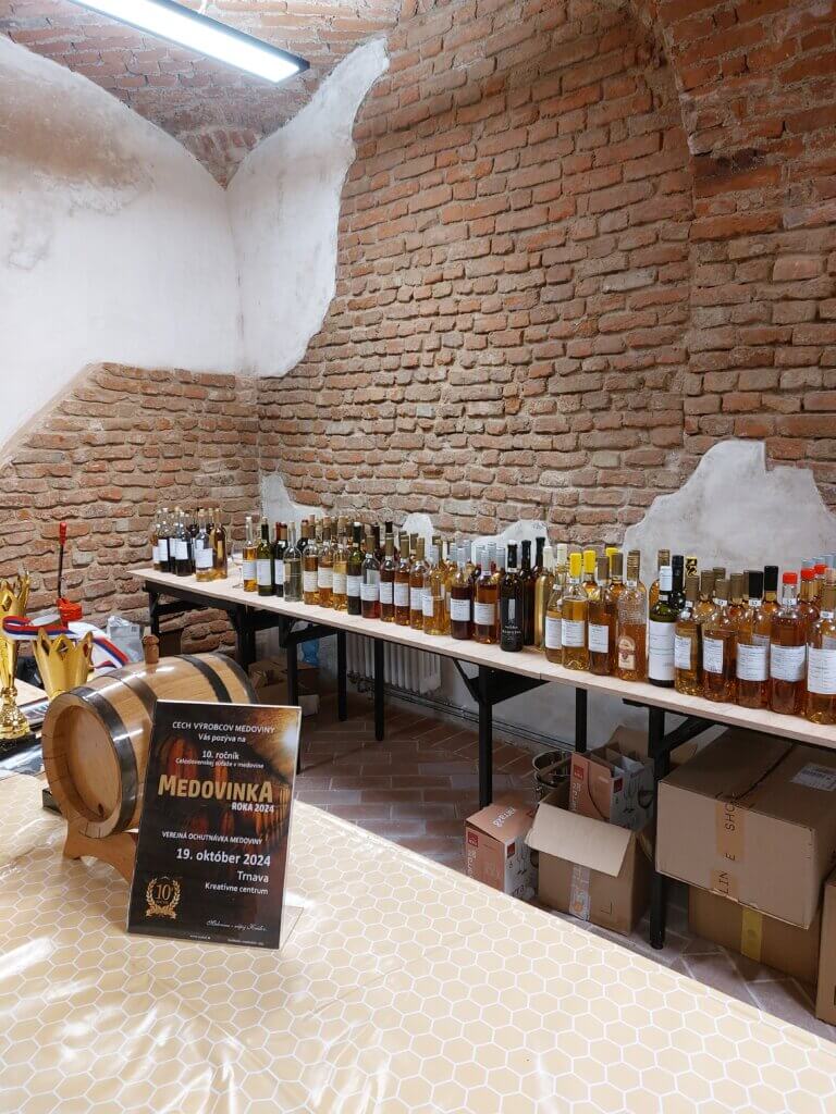 Bottles of mead lined up on a long table