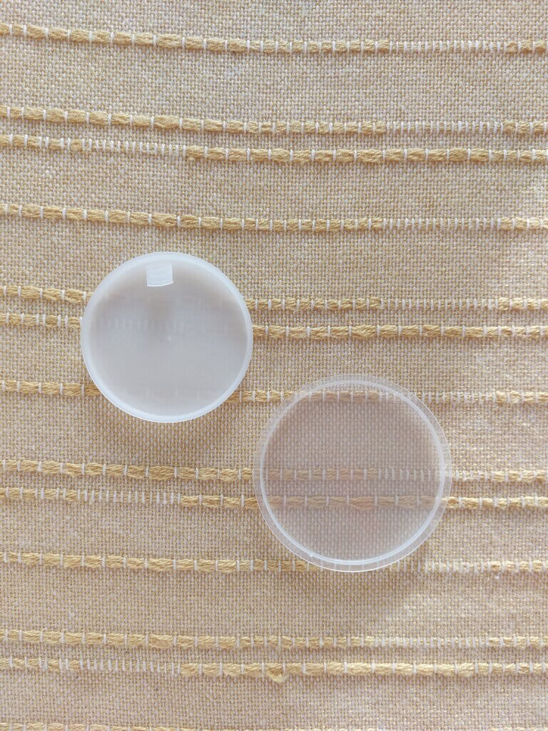 Two plastic round protective covers