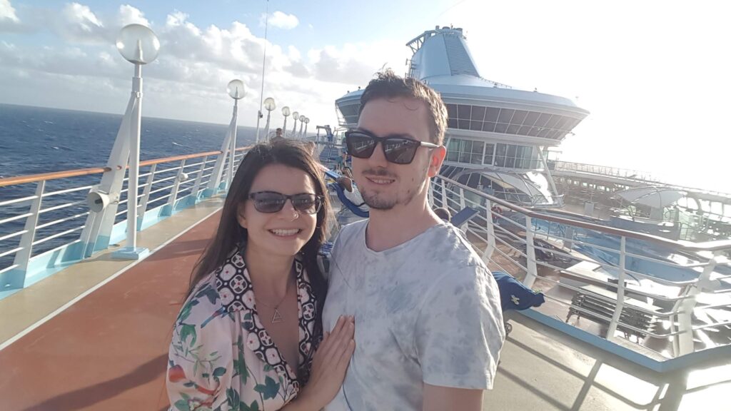 Mirka and Daniel taking a selfie on a cruise ship
