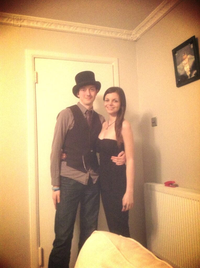 Mirka and Daniel posing in a sepia-coloured pic