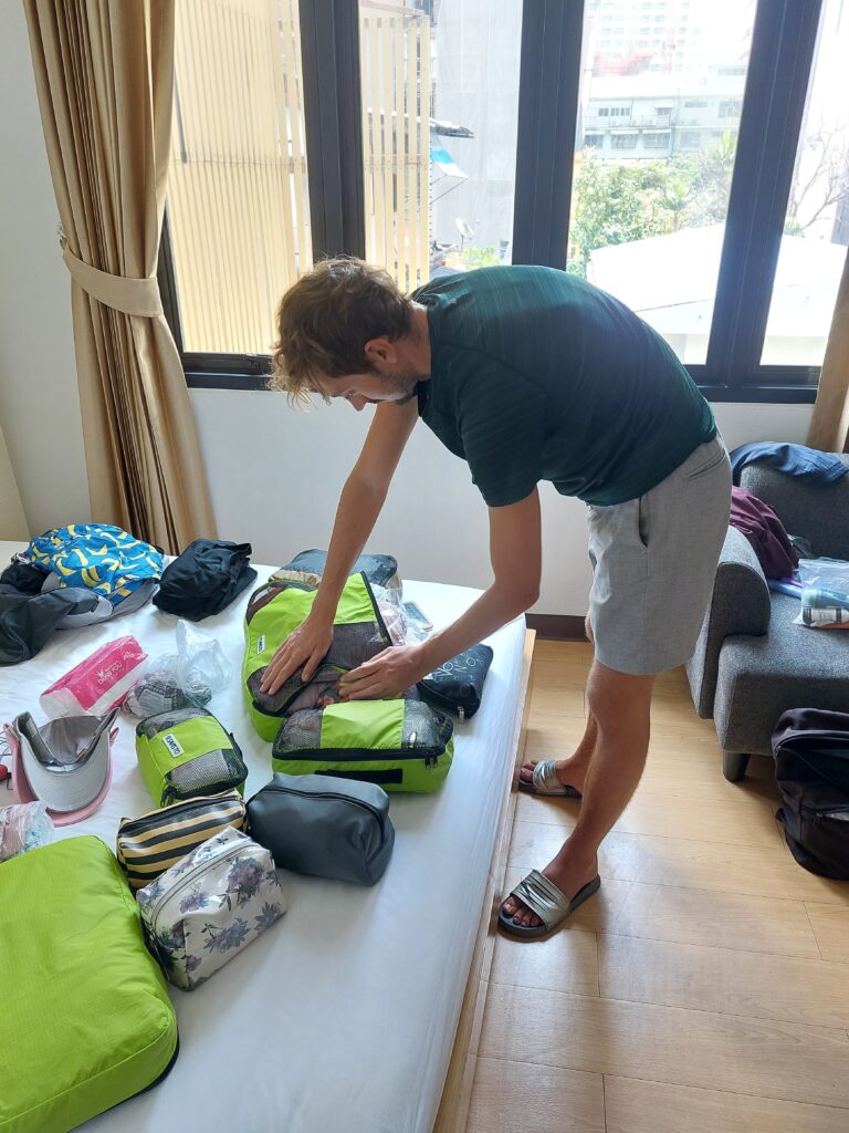 Daniel showing how to pack for full-time travel