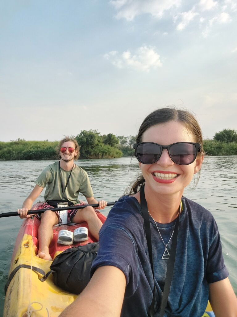 Mirka taking a selfie of her and Daniel in a double kayak