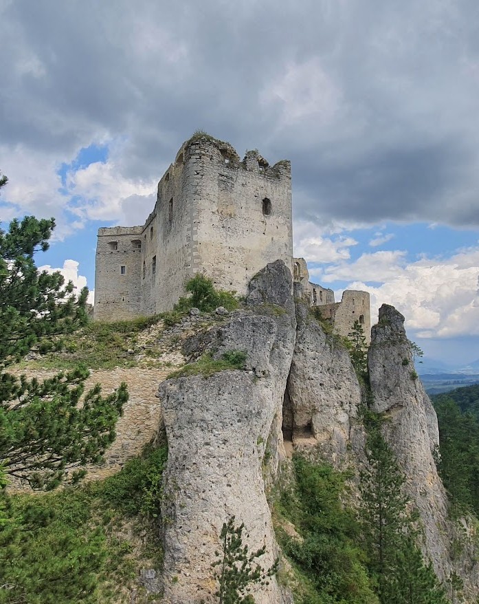 Castle ruins and a tower on a rocky cliff