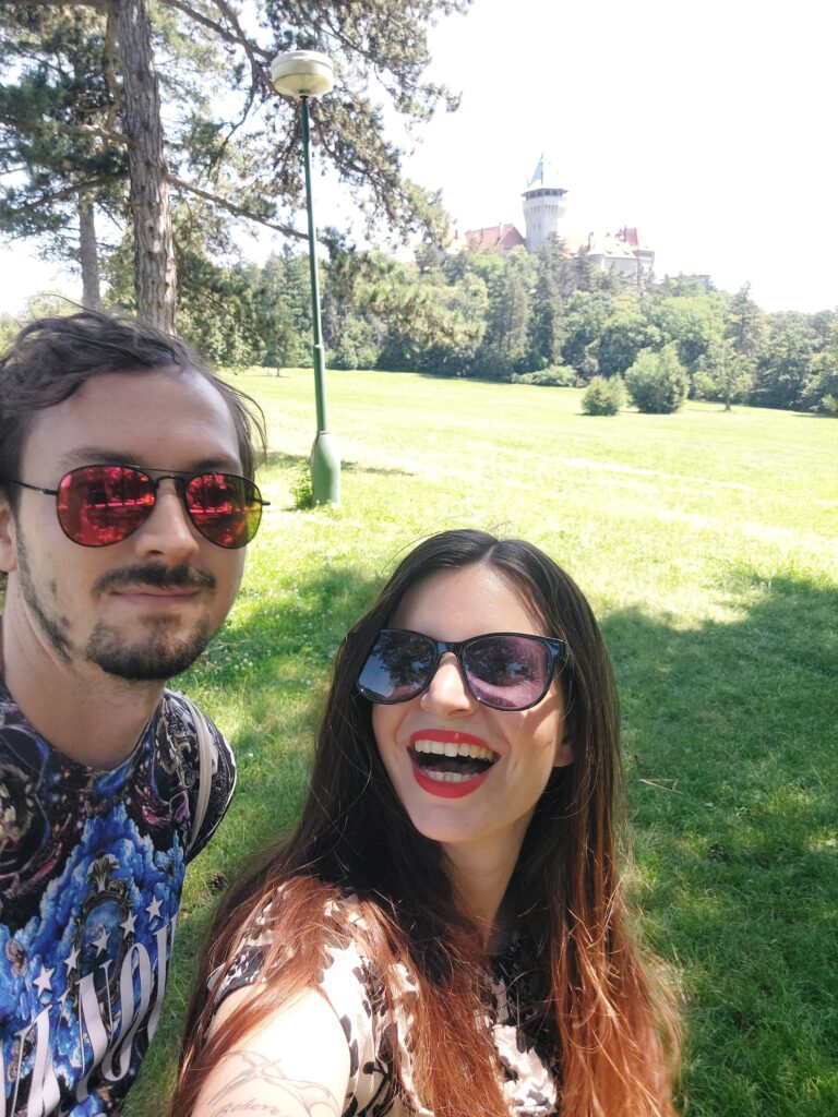 Mirka and Daniel taking a selfie in front of a castle