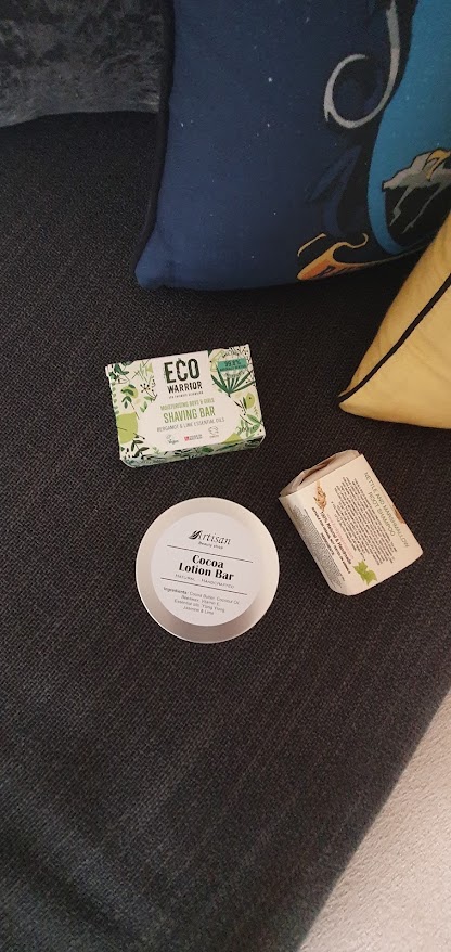 Lotion bar, shampoo bar and a shaving bar on a sofa
