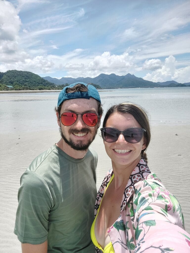 Bad Travel Insurance Companies: Our Controversial Opinion 11 Mirka and Daniel posing at a beach