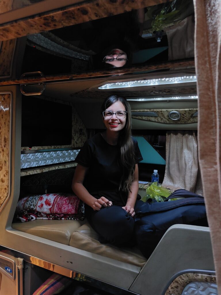 Mirka sitting on a night bus
