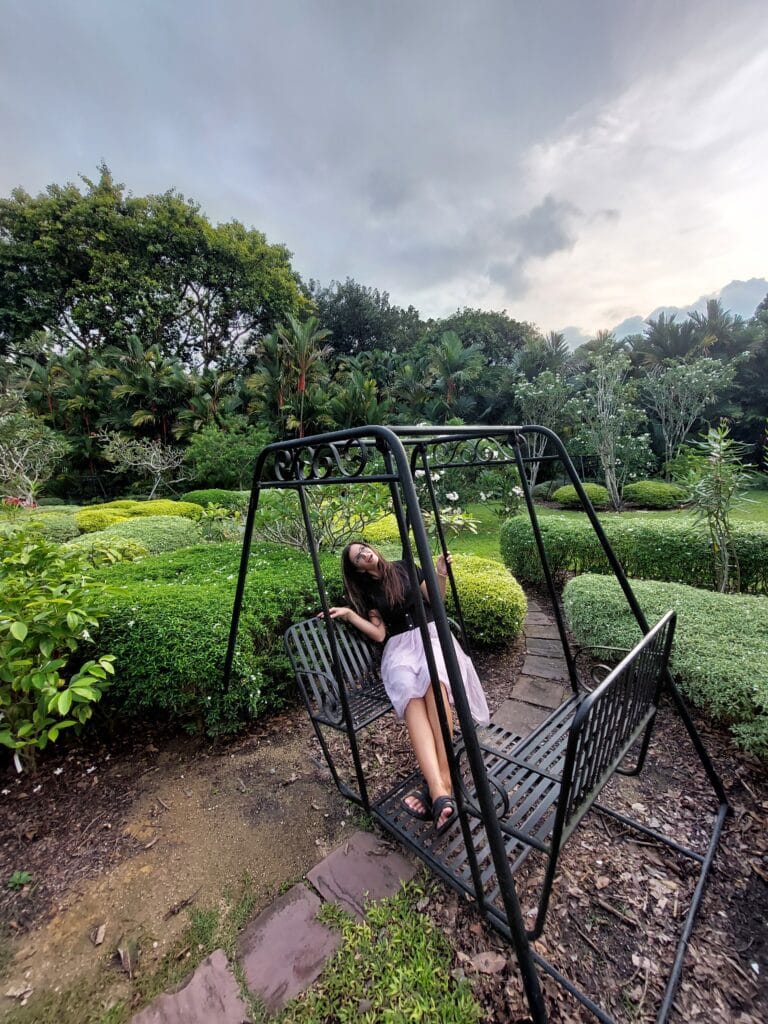 Mirka on a swing in a garden