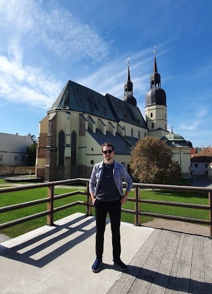 Daniel posing in front of a basilica