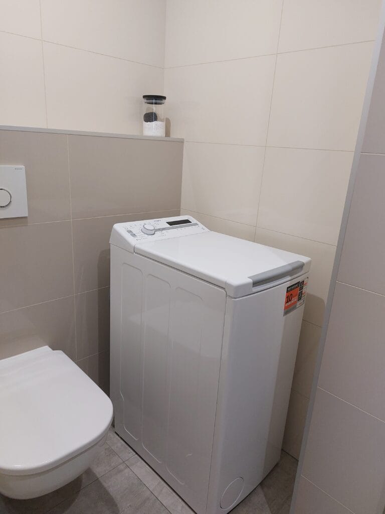 Can You Drink Tap Water in Slovakia? Yes — But Here’s What You Need to Know 4 A toilet and a washing machine in a bathroom
