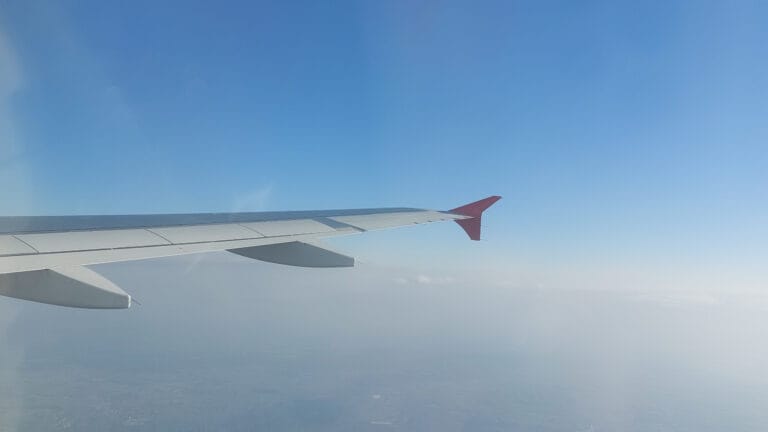 Plane's wing in the sky