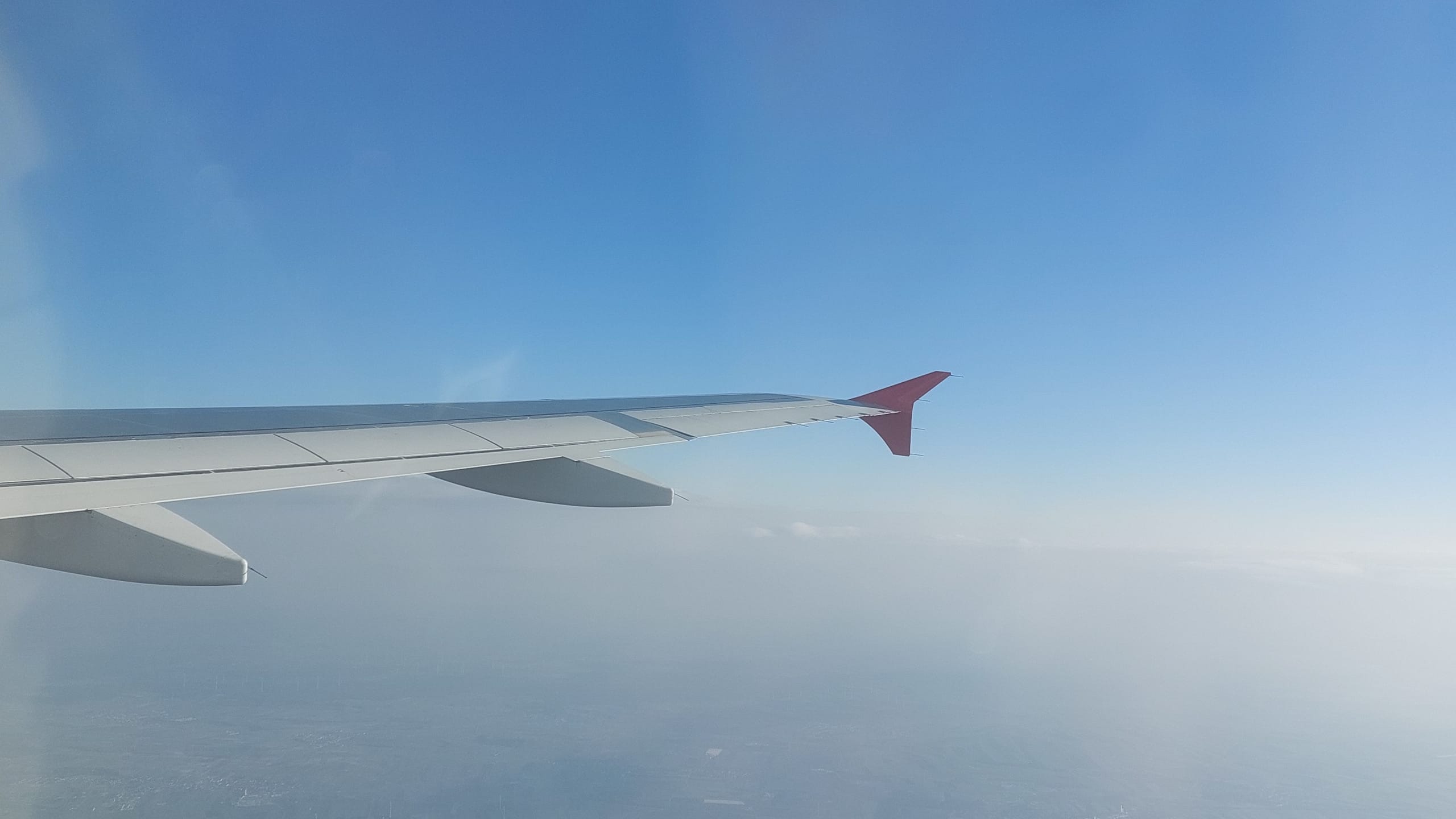 Plane's wing in the sky