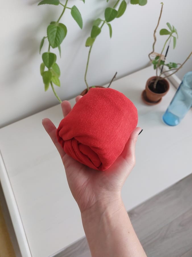 A rolled-up red T-shirt