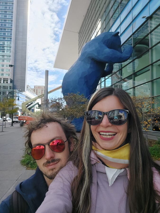 Mirka and Daniel taking a selfie with a big blue bear