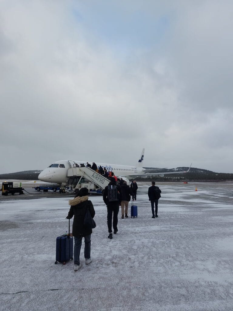 People going to a plane in Lapland