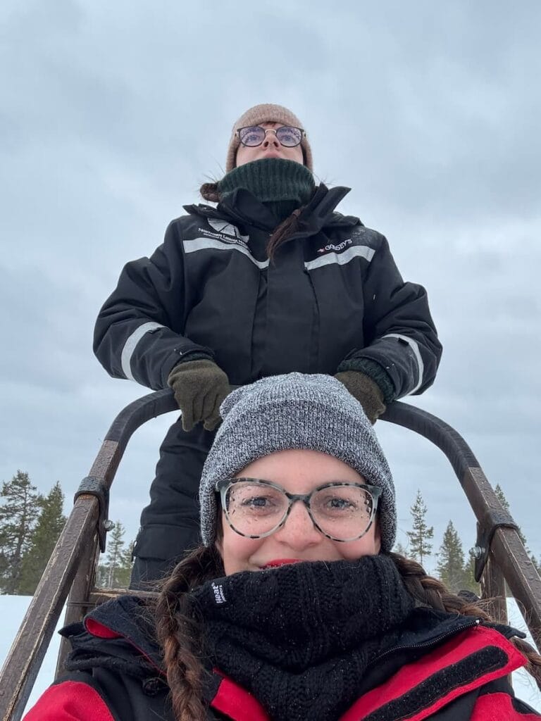 Mirka and her sister on a husky ride in Lapland