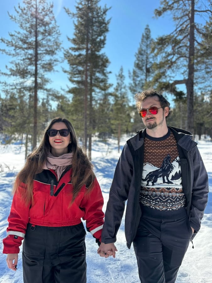 Mirka wearing a snowsuit and Daniel wearing an unzipped jacket