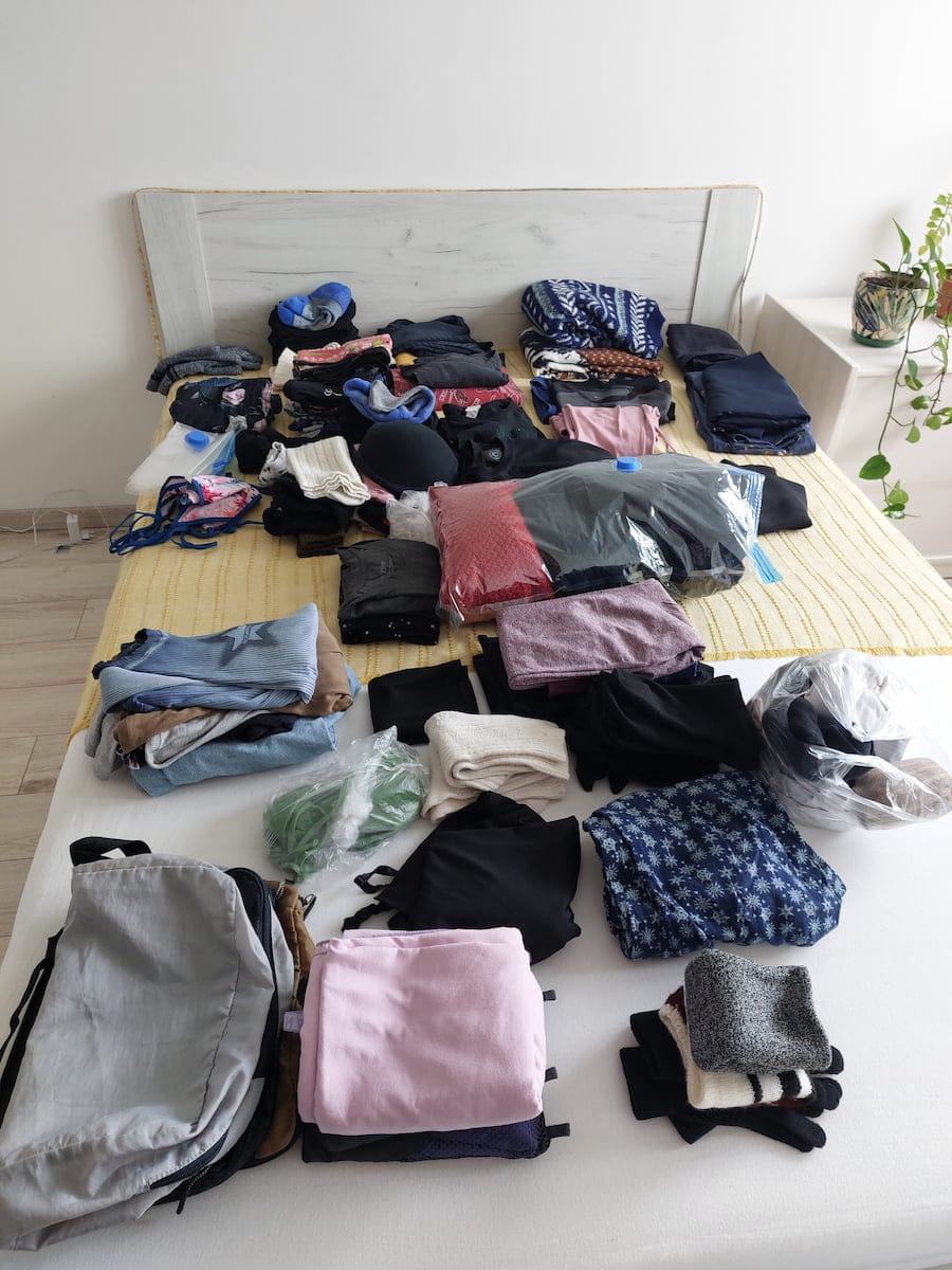 A bed covered in clothes for Lapland