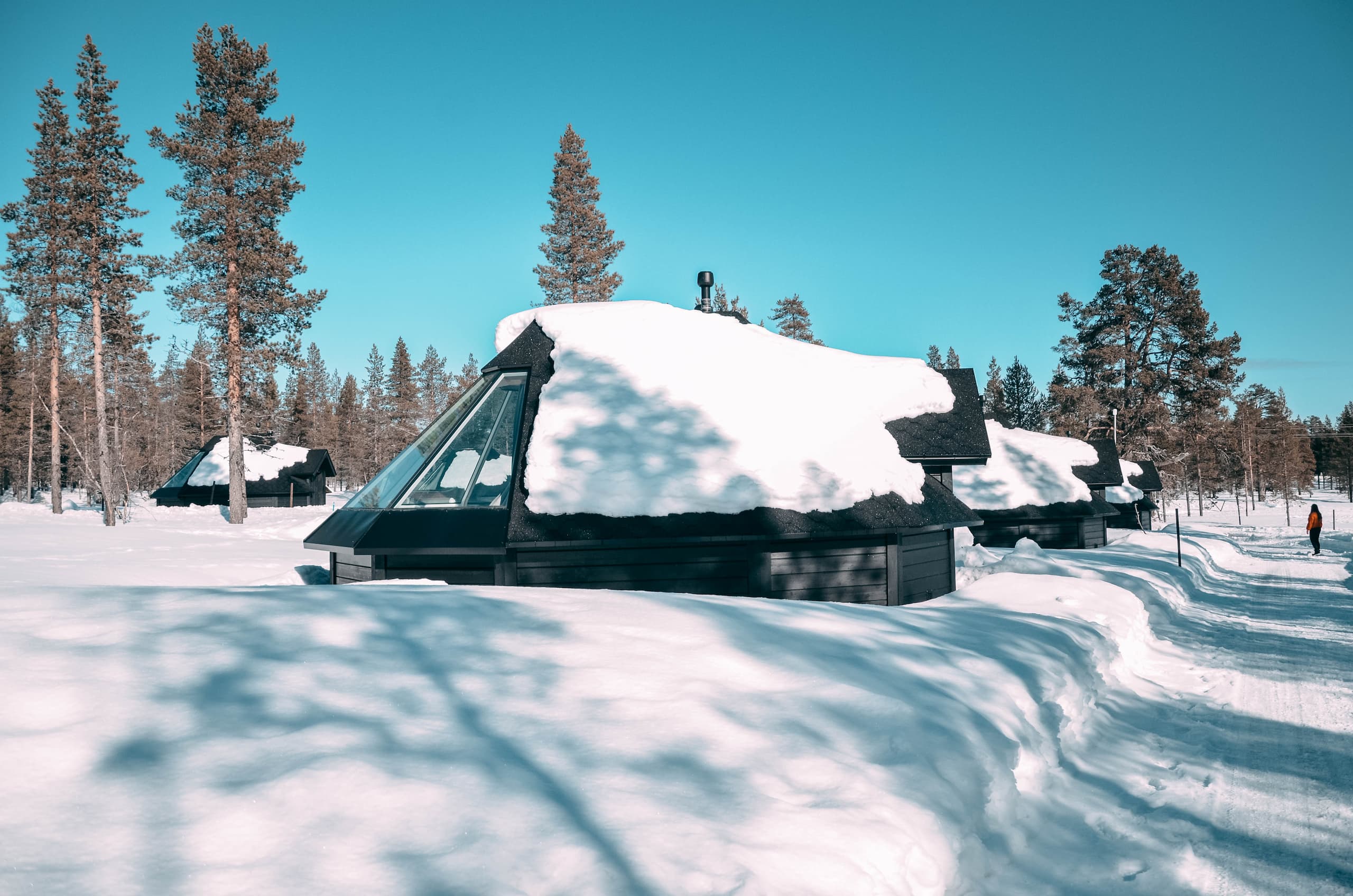 Glass roof cabin in snow