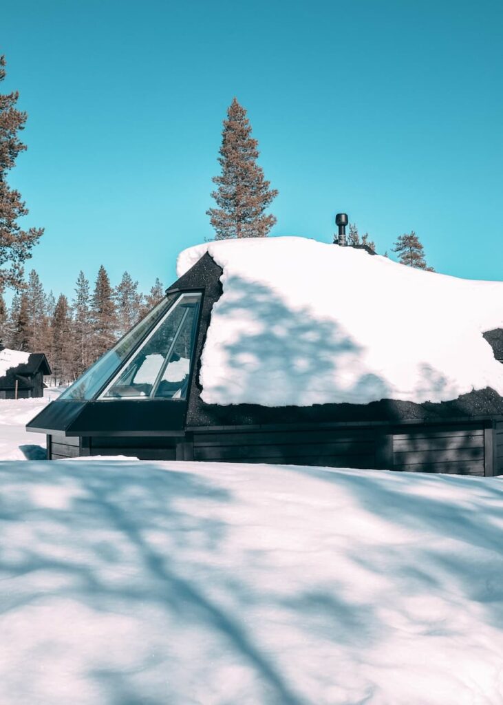 Glass-roof cabin in snow