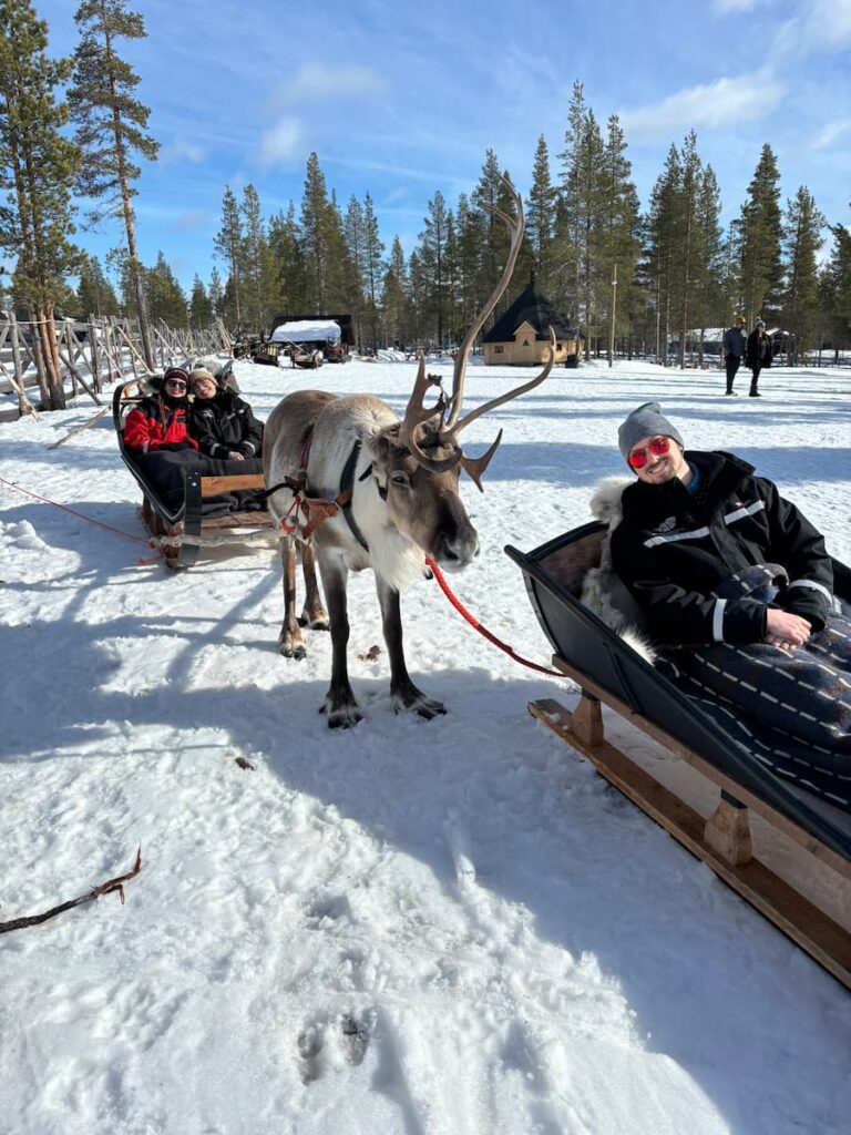 Mirka, Daniel and Mirka's sister before a reindeer sleigh ride in Lapland