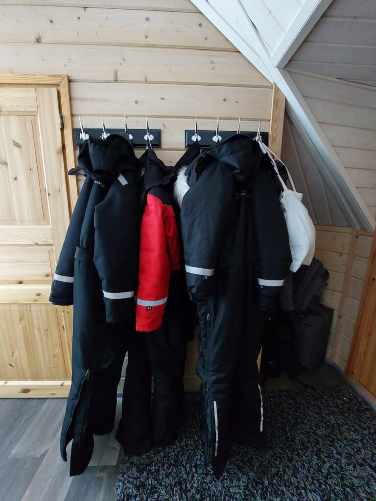 Snowsuits hanging on hooks