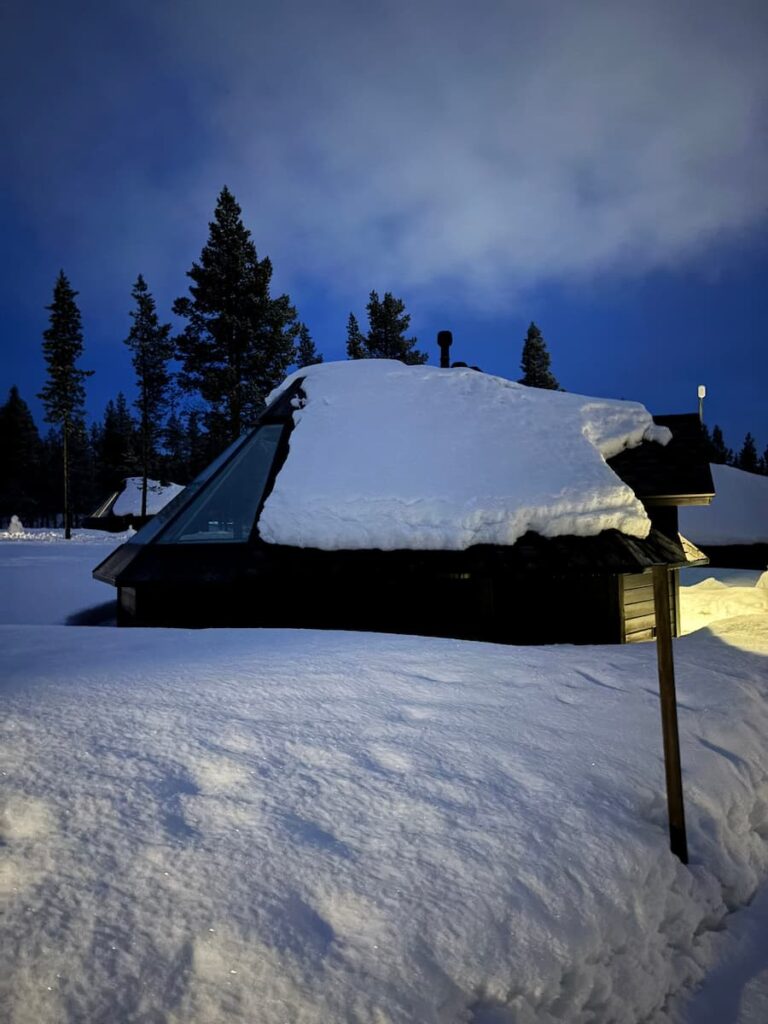 Glass-roof cabin in snow
