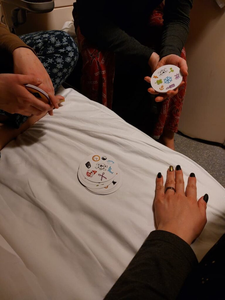 Santa Claus Express Train: The Ultimate Guide 14 Playing Dobble on a bed on the Santa Claus Express train