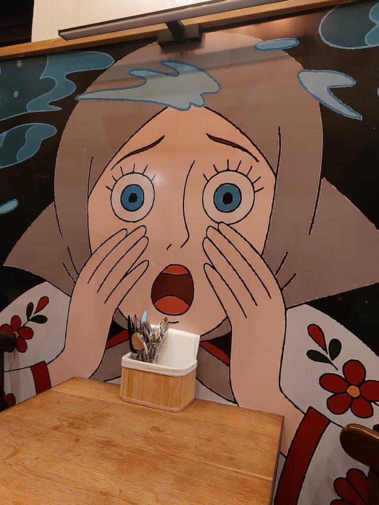 5 Best Cities to Visit from Bratislava—Easy Guide 16 A shocked girl painting on a wall