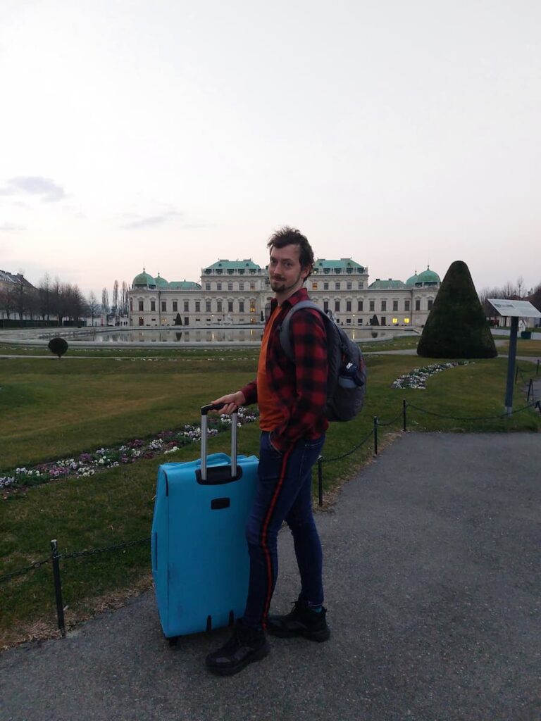 Daniel with a suitcase at Belvedere Palace