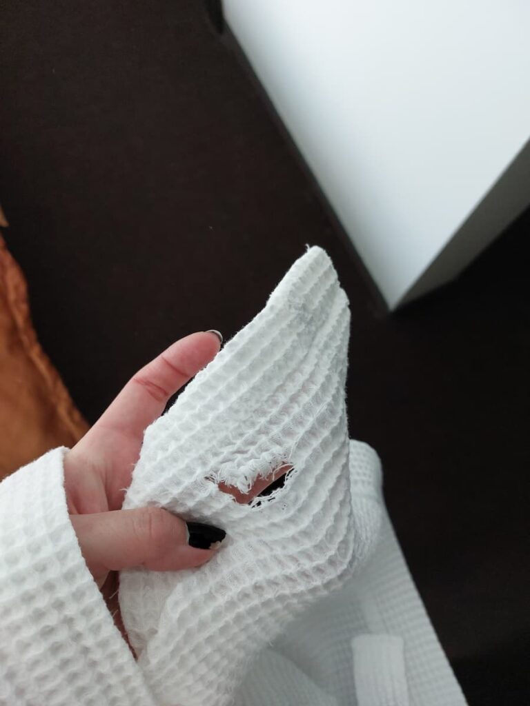 Enchanted…ish: Our Shockingly Bad 4 Star Hotel Stay in Slovakia 7 Hole in a hotel dressing gown