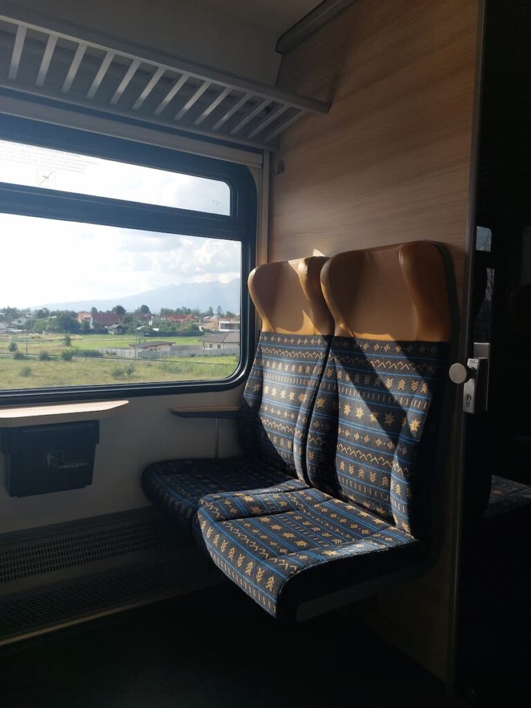 Seats on a train with folklore pattern