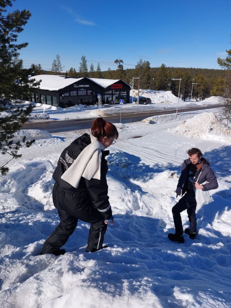 Mirka's sister walking down a hill of snow
