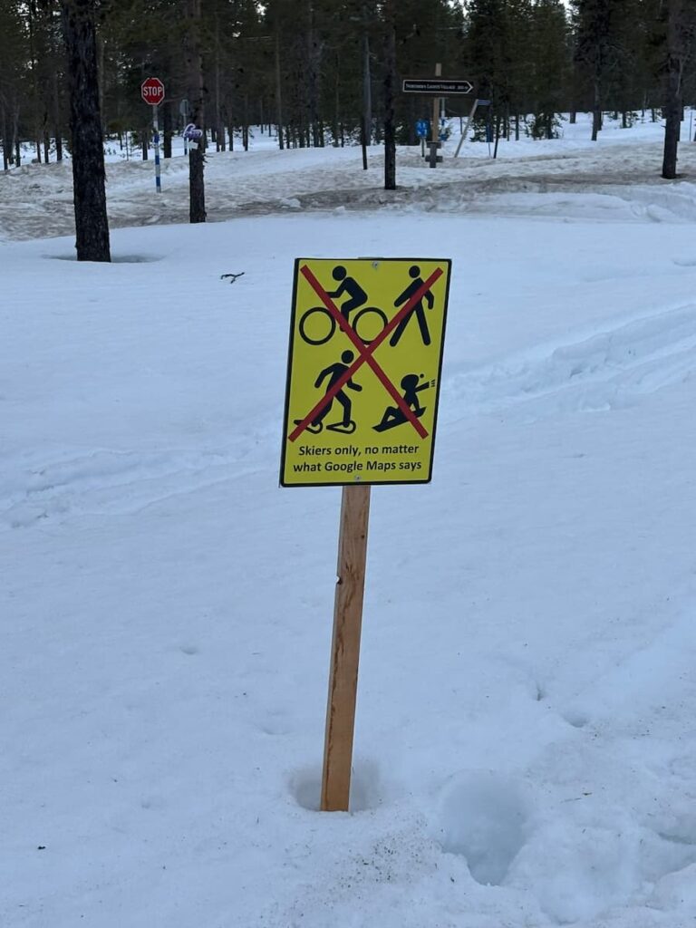 "Skiers only" sign on a snow track in Saariselkä
