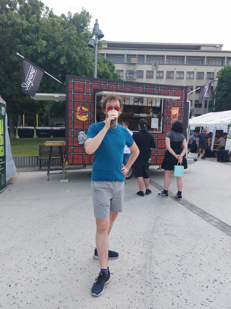 Products Made in Slovakia: 9 Unique Souvenirs Worth Buying 14 Daniel drinking beer at an outdoor beer festival